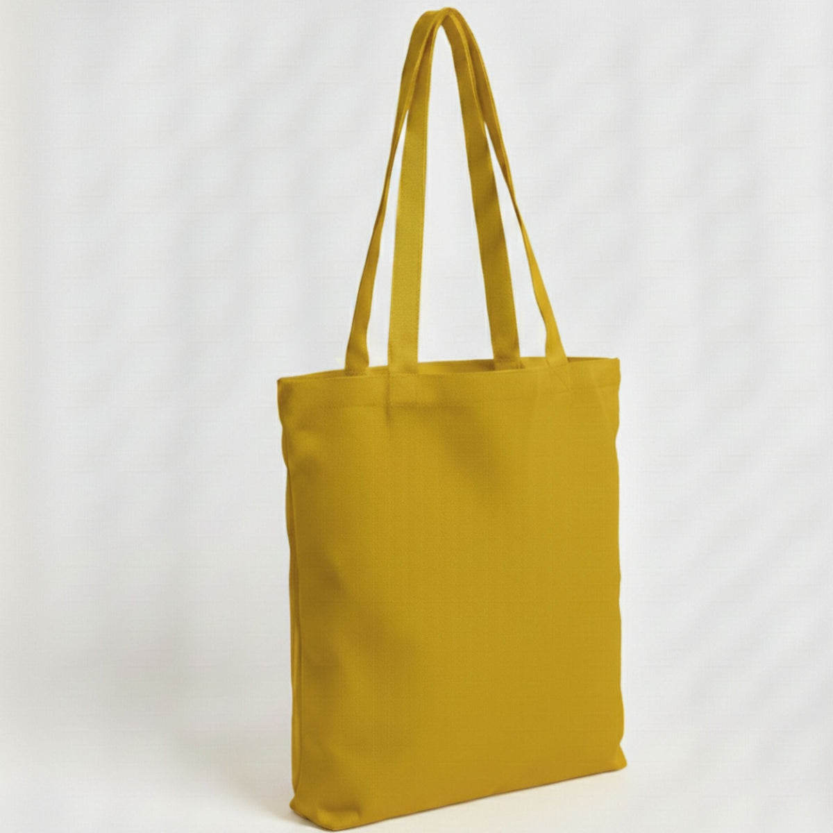 Toptan Bez Çanta marka 38x40 cm boyutlarında, hardal sarısı renkli, %100 pamuklu, dayanıklı günlük bez çanta.