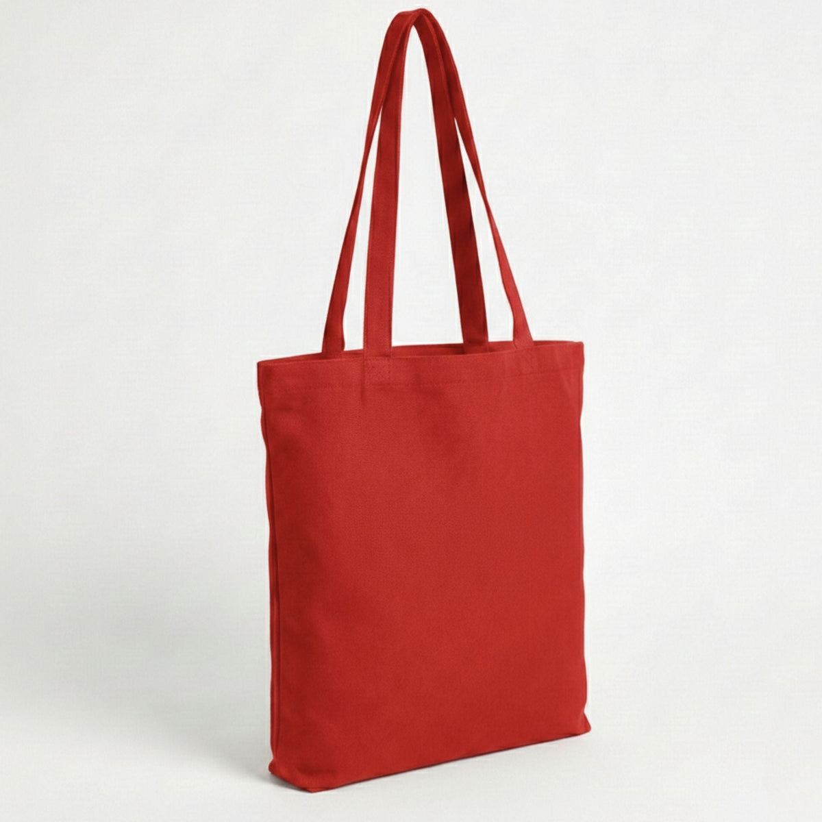 Toptan Bez Çanta marka 38x40 cm boyutlarında, %100 pamuklu kumaştan üretilmiş canlı kırmızı renkli bez çanta.