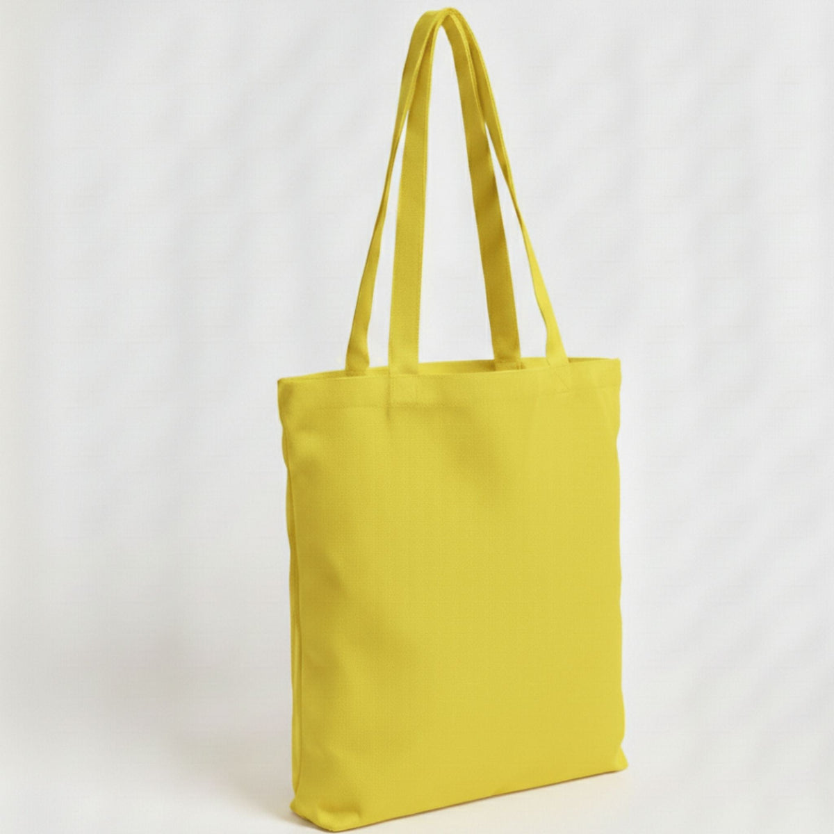 Toptan Bez Çanta marka 38x40 cm boyutlarında, %100 pamuklu, canlı sarı renkli, dayanıklı günlük bez çanta